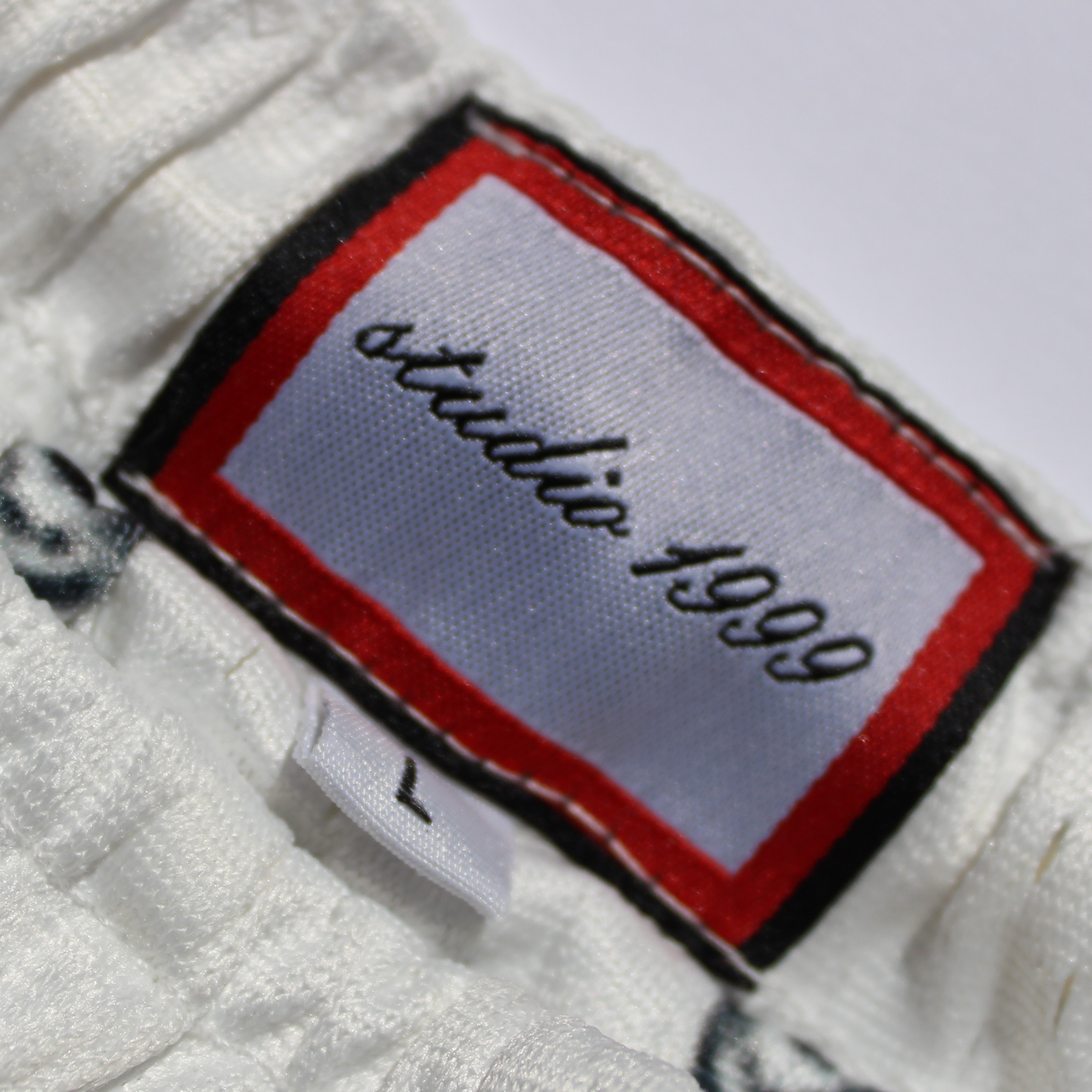 Pantalones cortos de malla con estampado de cachemira de Panda