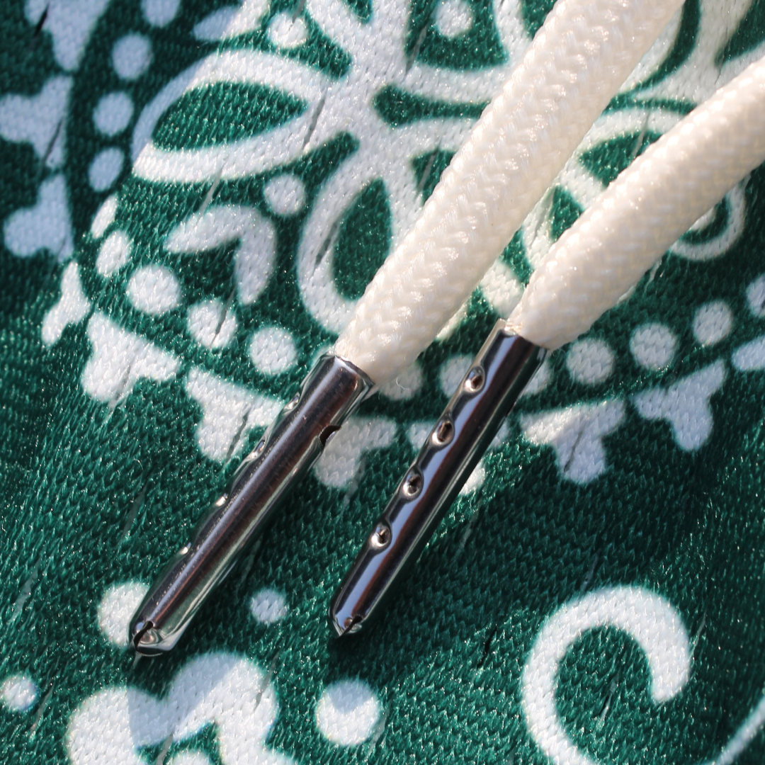 Pantalones cortos de malla de peso pesado: verde con estampado paisley blanco